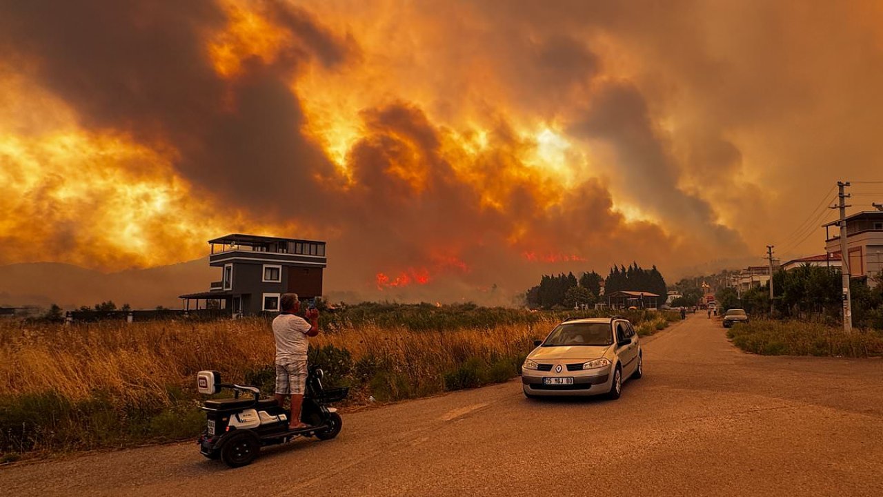 Travel chaos as fires tear through holiday hotspot as Europe scorches