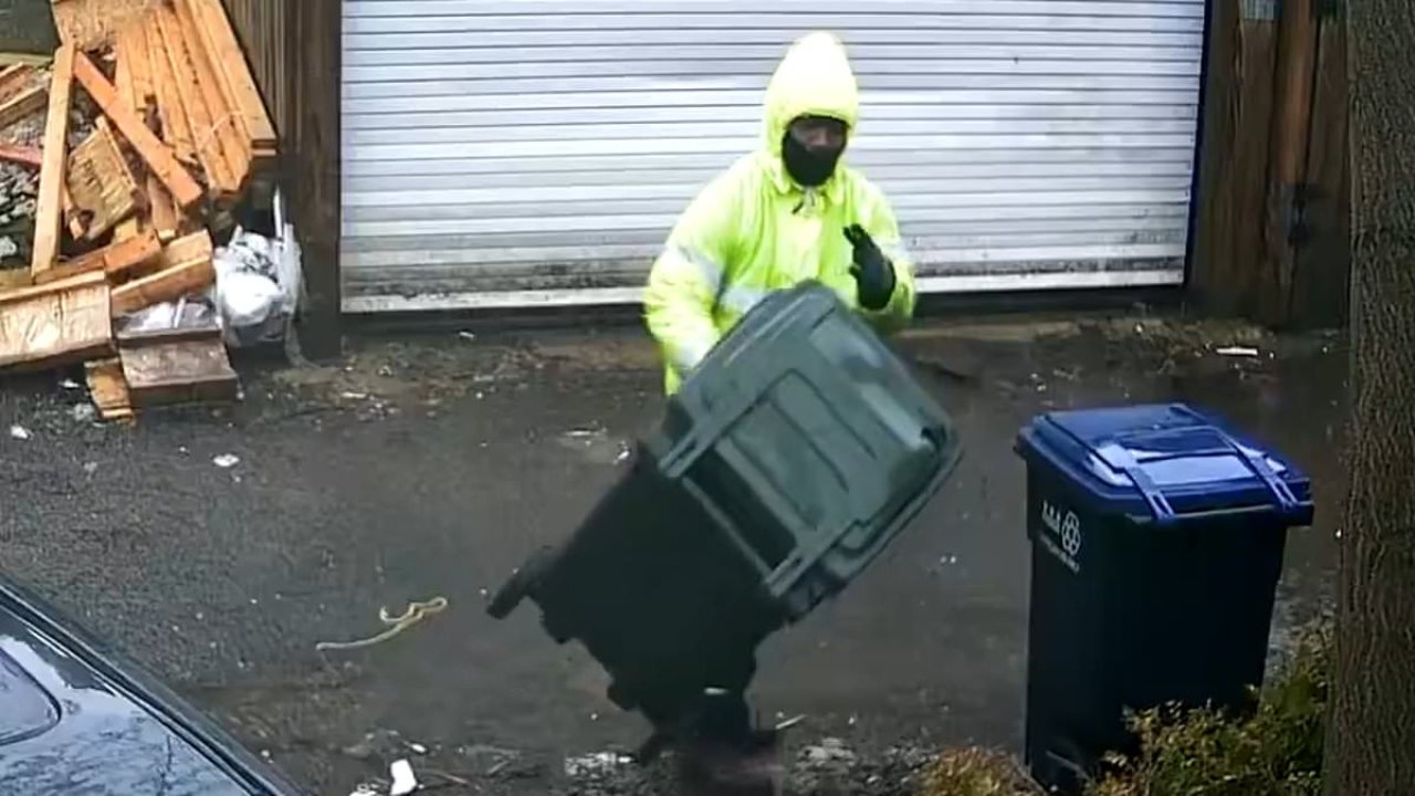 DC garbage collector filmed hurling trash cans down alley