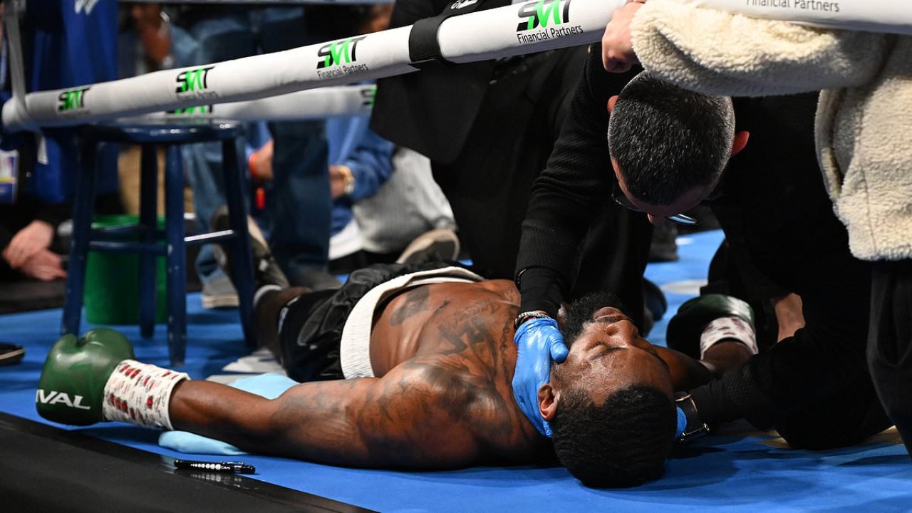 Terrifying moment boxer collapses off stool in break after first round