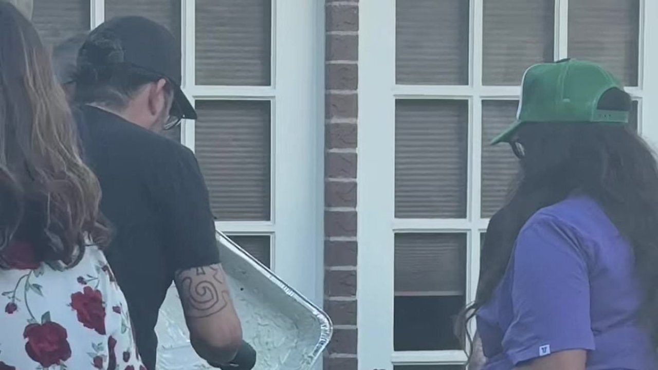 Dave Grohl stuns partygoers by taking over grill and serving coleslaw
